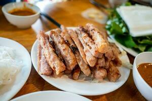 Grilled pork wrap and roll in vegetable herbs photo