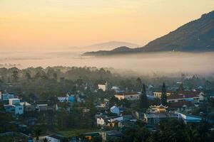 Mountains during dawn. Beautiful natural landscape in the summer time with fog photo