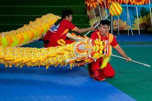 Ho Chi Minh, Viet Nam - 22 April 2023 Dragon dance, celebrate the new year. At the park photo