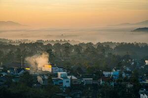 Mountains during dawn. Beautiful natural landscape in the summer time with fog photo