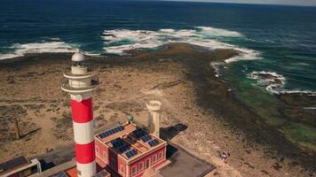Departure from the lighthouse on a circular trajectory, beautiful rocky shore. video