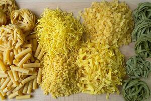 Layout of Italian raw pasta, different types and shapes of pasta photo