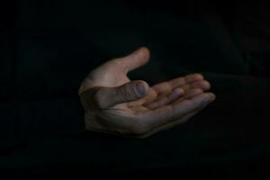 praying hands on black background photo