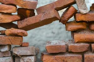 hole in the old bricks wall crumbling photo