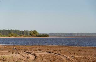 summer landscape on the banks of the river in the city of federation province of entre rios argentina photo