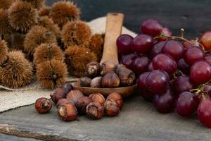 Up close chestnuts and grapes for the celebration photo