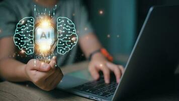 Artificial intelligence AI concept. Hand holds brain with shining wireframe, Neural networks in the light bulb of business networking technology innovation. photo