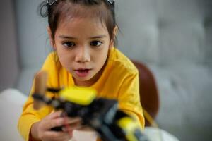 STEM education concept. Asian students learn at home by coding robot arms in STEM, mathematics engineering science technology computer code in robotics for kids' concepts. photo