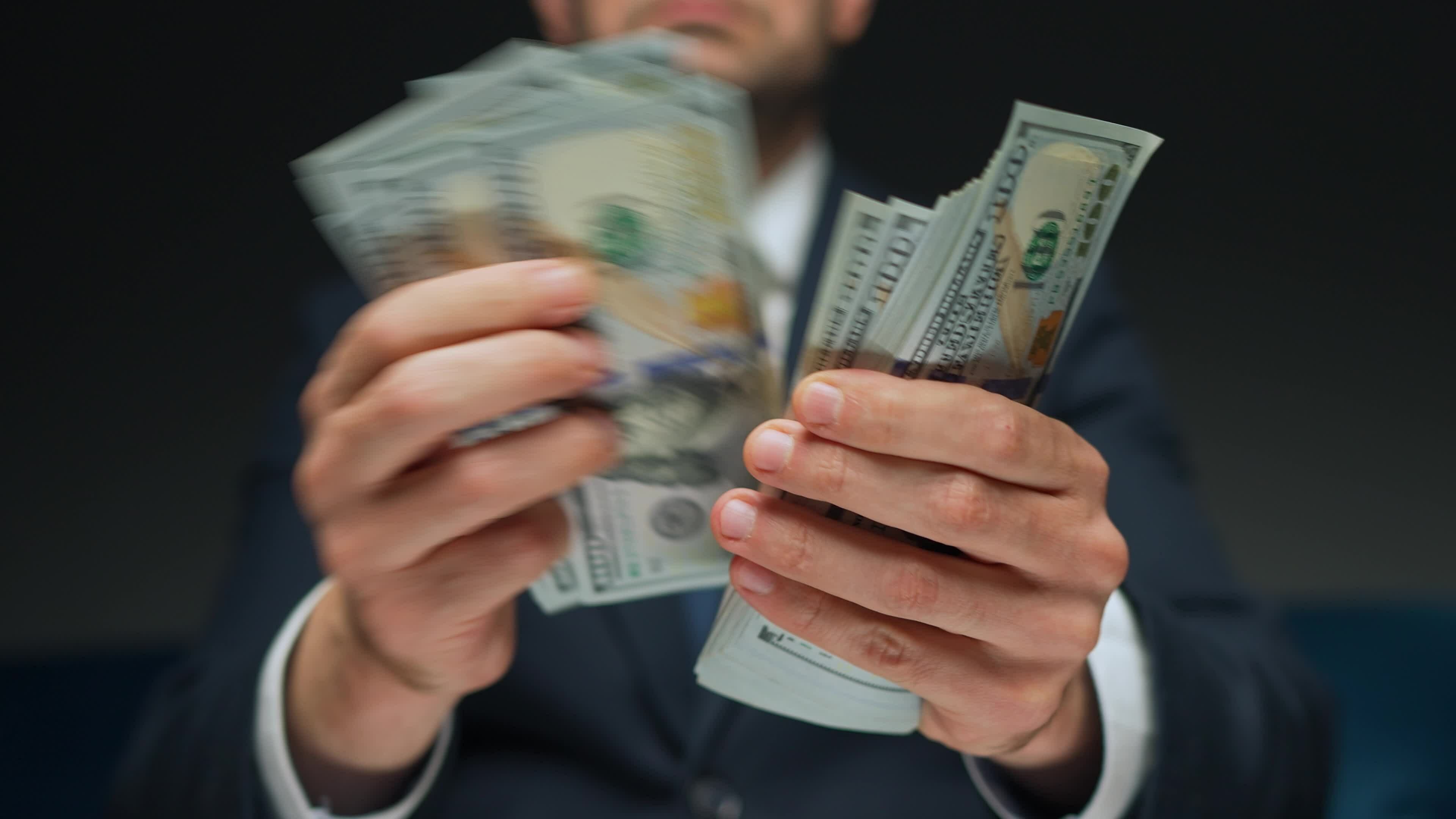 Formally Dressed Man Counting US Dollar Bills Close up 24869916 Stock formally-dressed-man-counting-us-dollar-bills-close-up-24869916-stock