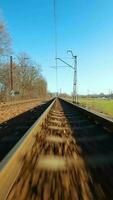 Fast flight close to train tracks in a clear sunny day video