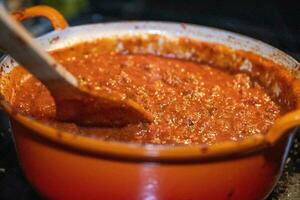 Mixing tomato beef sauce photo