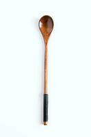 Wooden spoon with long handle on white background. photo