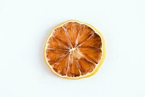 Dried orange slices on white background. photo