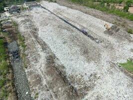 Aerial view landfill garbage waste huge dump environmental pollution problem, Top view on plastic and other industrial waste ecological disaster from above with garbage sorting garbage disposal photo