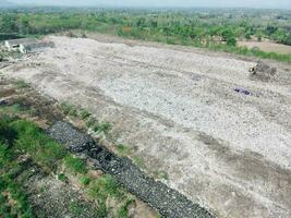 Aerial view landfill garbage waste huge dump environmental pollution problem, Top view on plastic and other industrial waste ecological disaster from above with garbage sorting garbage disposal photo