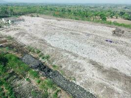 Aerial view landfill garbage waste huge dump environmental pollution problem, Top view on plastic and other industrial waste ecological disaster from above with garbage sorting garbage disposal photo