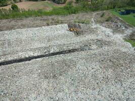 Aerial view landfill garbage waste huge dump environmental pollution problem, Top view on plastic and other industrial waste ecological disaster from above with garbage sorting garbage disposal photo