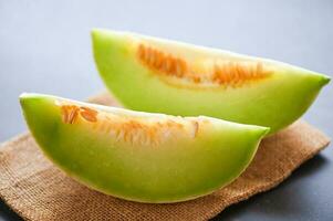 cantaloupe thai slice fruit for health green cantaloupe thailand, cantaloupe melon on wooden plate photo