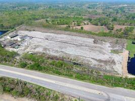 Aerial view landfill garbage waste huge dump environmental pollution problem, Top view on plastic and other industrial waste ecological disaster from above with garbage sorting garbage disposal photo