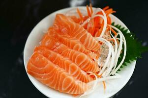 salmon sashimi food salmon fillet japanese menu with shiso perilla leaf lemon herb and spices, fresh raw salmon fish for cooking food seafood salmon fish photo