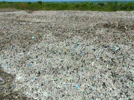Aerial view landfill garbage waste huge dump environmental pollution problem, Top view on plastic and other industrial waste ecological disaster from above with garbage sorting garbage disposal photo