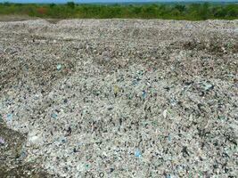 Aerial view landfill garbage waste huge dump environmental pollution problem, Top view on plastic and other industrial waste ecological disaster from above with garbage sorting garbage disposal photo