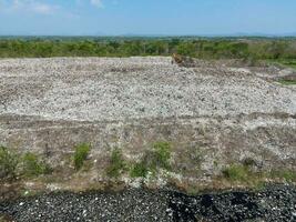 Top view on plastic and other industrial waste ecological disaster from above with garbage sorting garbage disposal , Aerial view landfill garbage waste huge dump environmental pollution problem photo