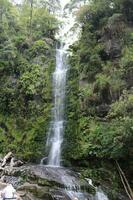 Waterfall over rocks photo