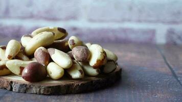 Brazilian nut on wooden board on table video