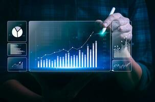 Businessman analyzing business enterprise data management, Business analytics with charts, metrics and KPIs to performance organization. Corporate strategy for finance, operations, sales, marketing photo