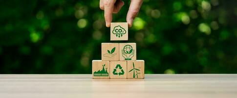 CO2 emission reduction concept, businessman with environmental technology Icons, global warming, sustainable development, renewable energy business. climate change, carbon capture, storage, reuse photo
