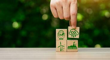 CO2 emission reduction concept, businessman with environmental technology Icons, global warming, sustainable development, renewable energy business. climate change, carbon capture, storage, reuse photo