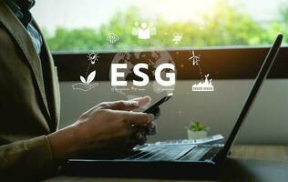 ESG environment social governance investment concept. Businessman using computer to analyze investment ESG. strategy that considers the environmental, company carbon labor practices, sustainability photo