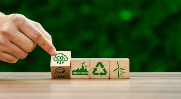 CO2 emission reduction concept, businessman with environmental technology Icons, global warming, sustainable development, renewable energy business. climate change, carbon capture, storage, reuse photo