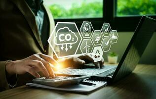 CO2 emission reduction concept, businessman with environmental technology Icons, global warming, sustainable development, renewable energy business. climate change, carbon capture, storage, reuse photo