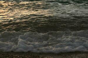 beautiful sandy beach and soft blue ocean wave photo