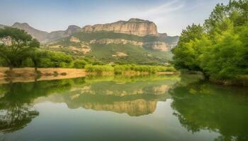 Majestic mountain range reflects in tranquil pond, natural beauty abounds generated by AI photo