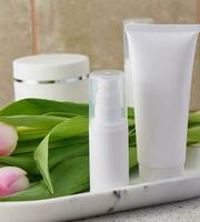 White plastic tubes for cosmetic products, advertising and branding of products photo