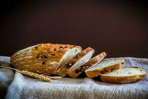 A loaf of bread with raisins on it photo