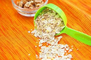 oatmeal in a volumetric spoon on a napkin Orange photo