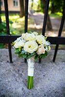 beautiful wedding bouquet in bright and gentle colors photo