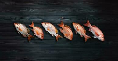 fresh raw fish on a wooden table photo