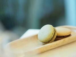 Macaron cofree and green tea, in wooden tray, Dessert snacks photo