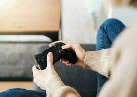 Girl playing on games console photo