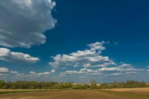 aerial panoramic view on blue sky dome background with white striped clouds in heaven and infinity may use for sky replacement photo