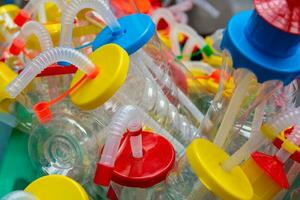 drink bottles with plastic straws photo