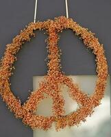 a peace sign as decoration with flowers photo