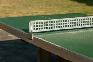 ping pong table in a city park photo