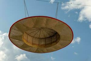 large decorative straw hat with a view of the sky photo