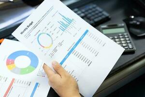 Budget planning concept. Business  Planning Strategy Analysis discussing new plan financial graph data. Work with document graphs Concept. photo
